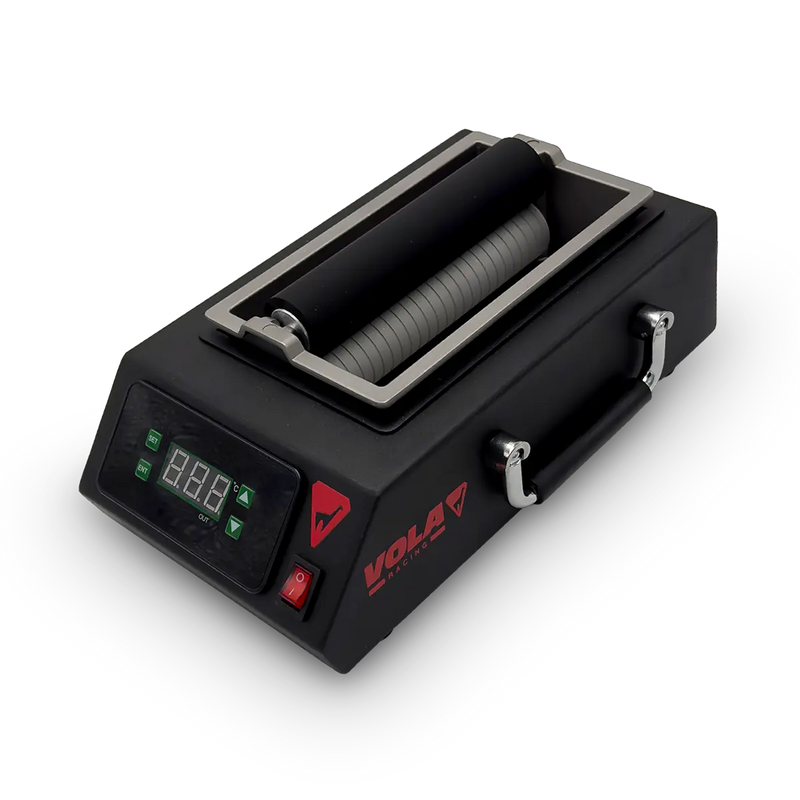 Chargez l'image dans le visualiseur de galerie, Wachsmaschine in schwarz mit rotem VOLA Logo und Digitalanzeige. Wachsschale in grau ist in der Mitte eingelassen. Darin sind zwei Walzen übereinander angeordnet.